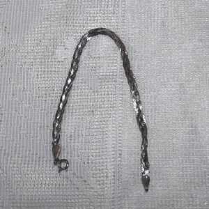 Vintage 925 sterling silver braided herringbone bracelet. 
beautiful shimmering